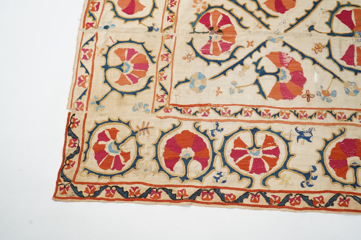A 19th century Uzbekistan Suzani, hand embroidered hanging. Made from hand woven linen panels each approximately 28cm wide x 167cm long. Hand embroidered with silk hand dyed threads, in orange, red, blue and yellows, usi